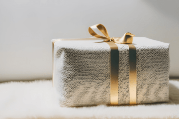 Wrapped gift box sitting on a Merino wool rug